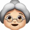 An old woman with glasses and a gray hat.