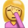 A woman with her hand over her eye.
