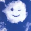 Smiling face-shaped cloud against blue sky