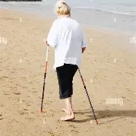Woman using exerstrider sticks Woman using exerstrider sticks