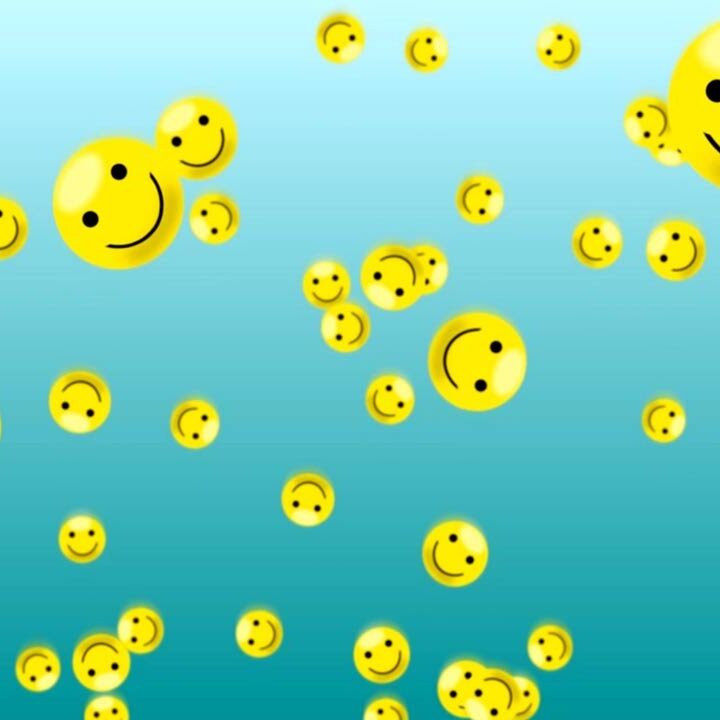 A bunch of smiley faces floating in the air