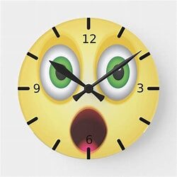 A yellow clock with an image of a face